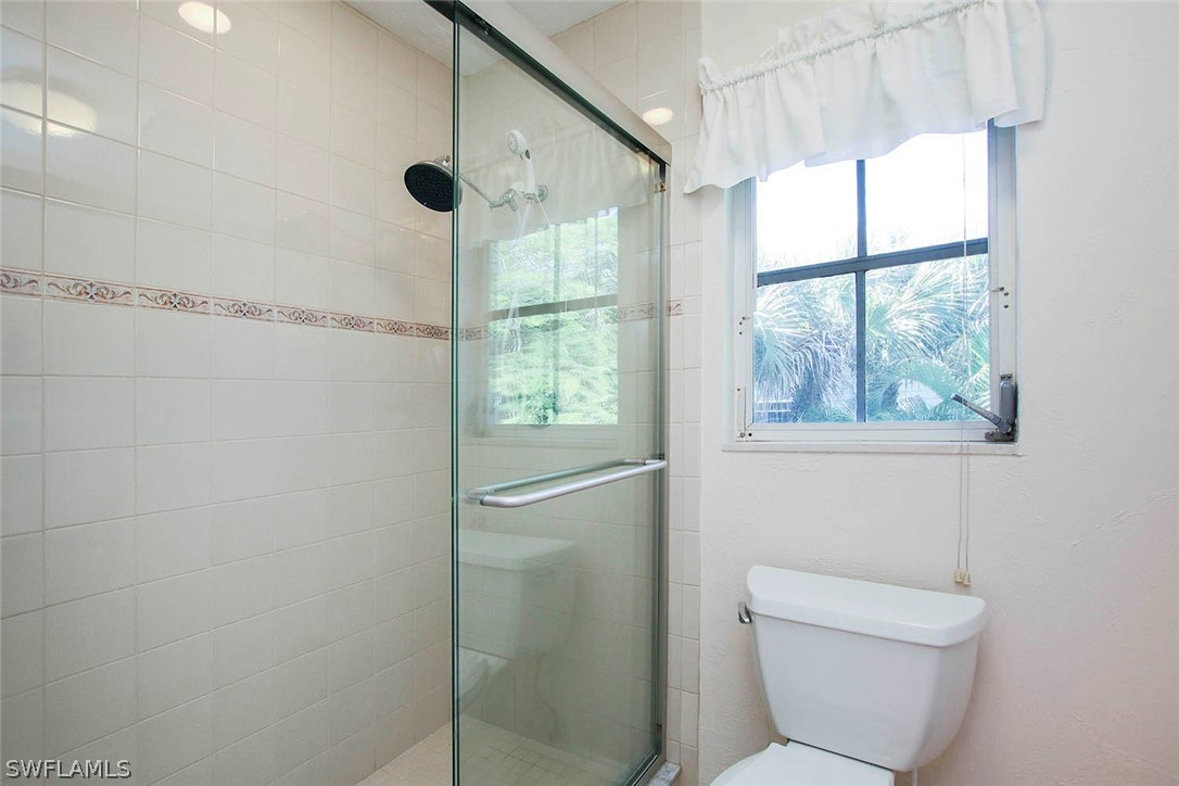 555 Rabbit Road Sanibel, FL 33957 - Photo 12 of 29 a bathroom with a toilet and a shower