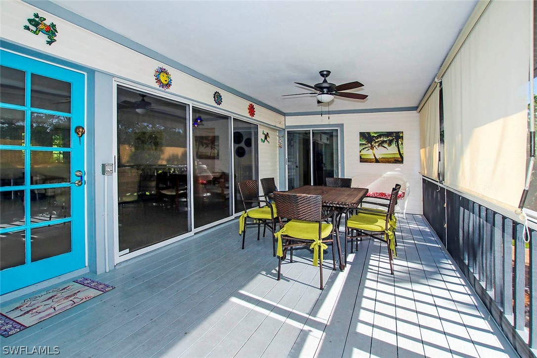 555 Rabbit Road Sanibel, FL 33957 - Photo 19 of 29 a view of a dining room with furniture and window