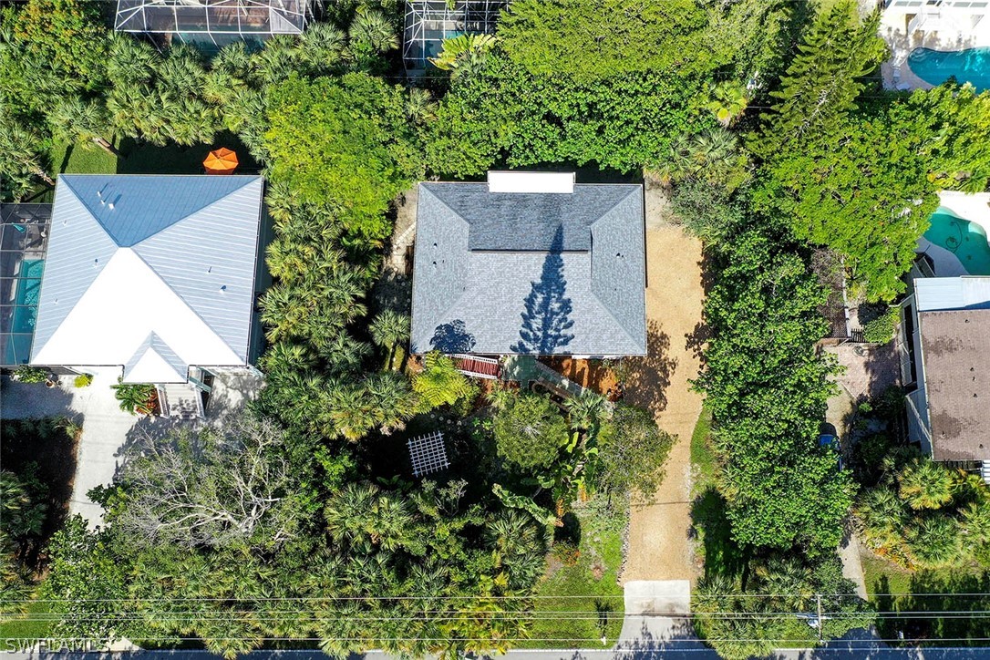 555 Rabbit Road Sanibel, FL 33957 - Photo 27 of 29 an aerial view of a house with a yard and garden