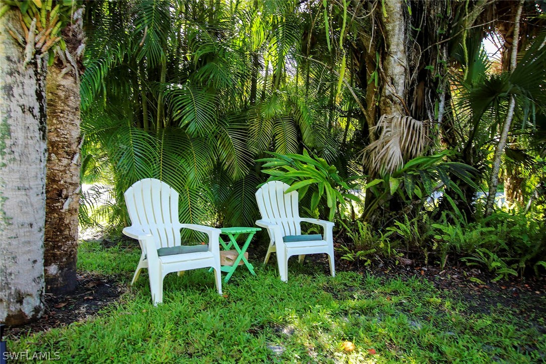 555 Rabbit Road Sanibel, FL 33957 - Photo 29 of 29 a chair table and chairs in the garden