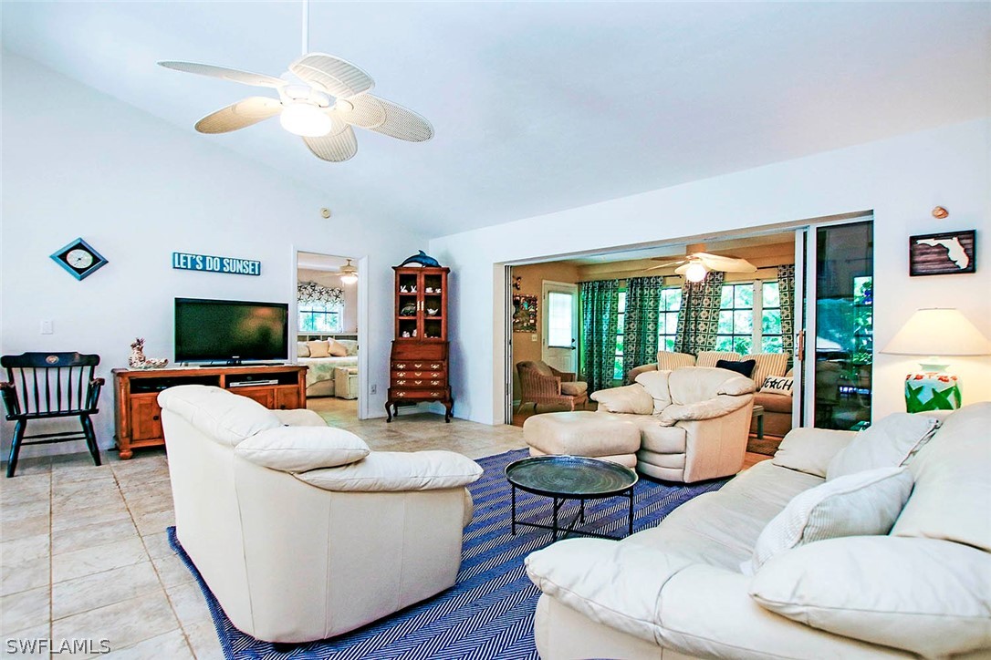 555 Rabbit Road Sanibel, FL 33957 - Photo 5 of 29 a living room with furniture and a flat screen tv