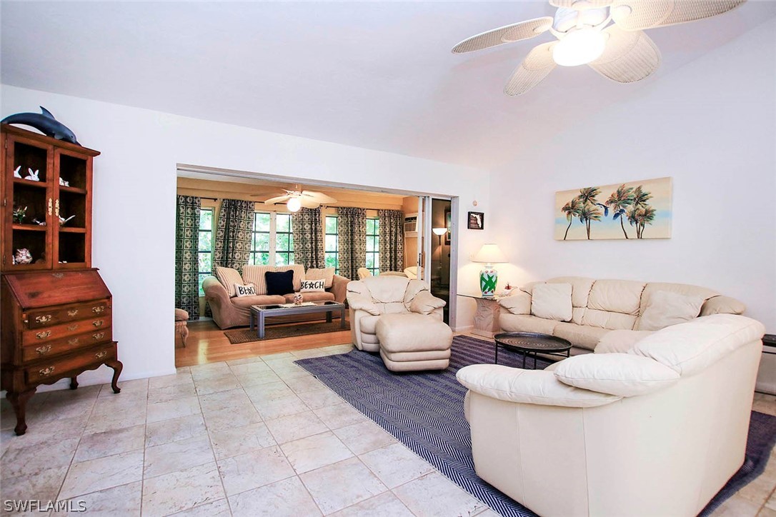 555 Rabbit Road Sanibel, FL 33957 - Photo 6 of 29 a living room with furniture and a large window