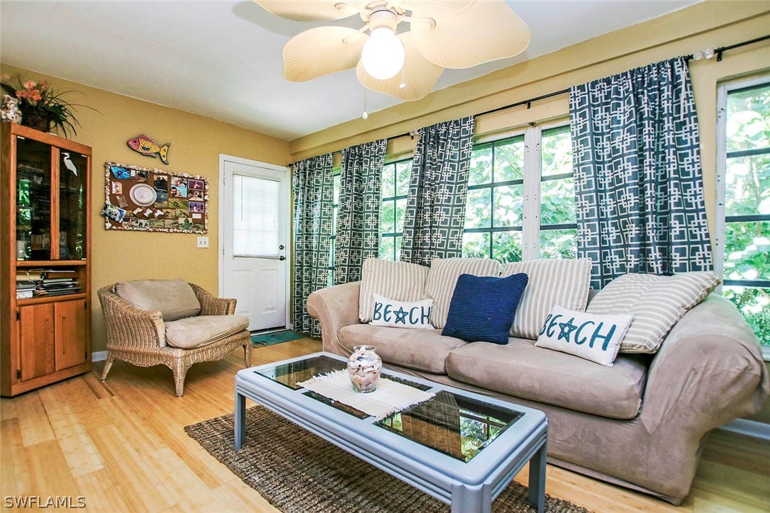 555 Rabbit Road Sanibel, FL 33957 - Photo 8 of 29 a living room with furniture and a large window