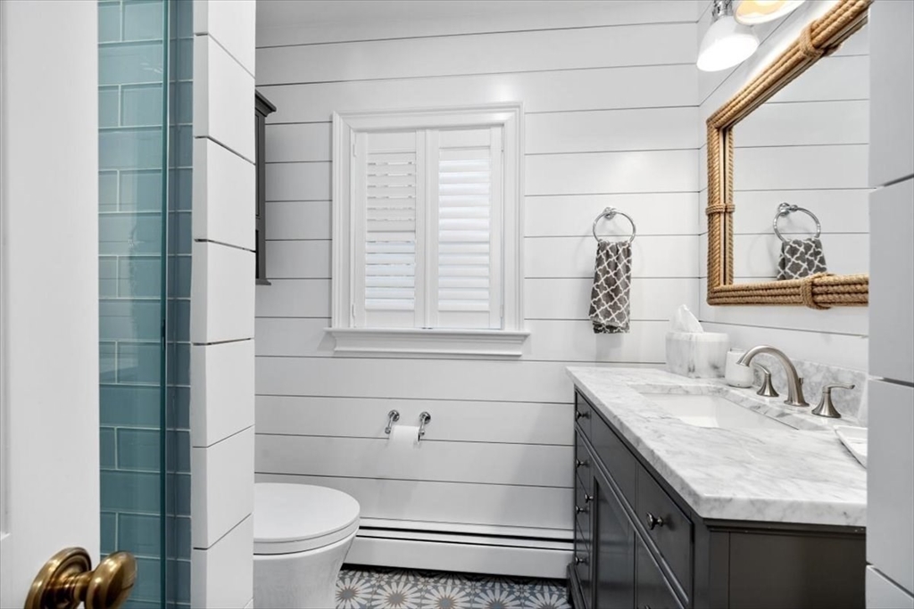 38 Smith Road Hingham, MA 02043 - Photo 22 of 42 a bathroom with a granite countertop sink toilet and mirror
