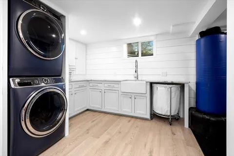 a view of a storage and utility room with washer and dryer