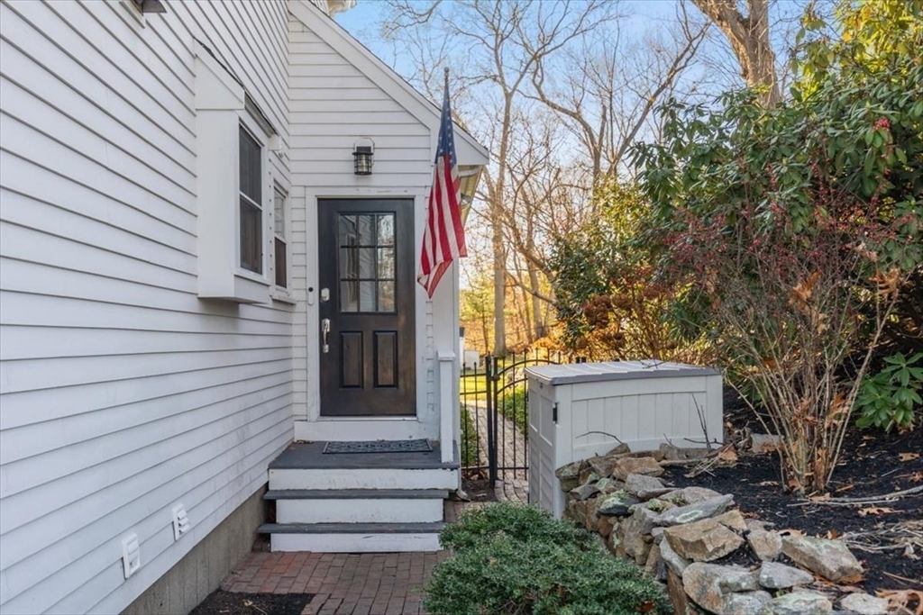 38 Smith Road Hingham, MA 02043 - Photo 31 of 42 a front view of a house with a tree