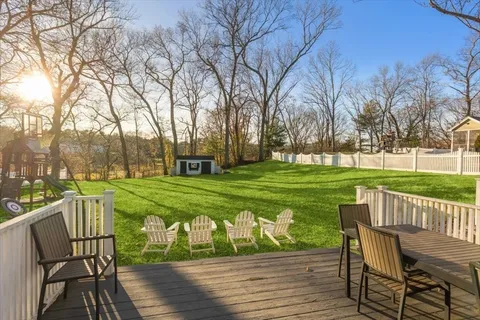 a view of a table and chairs on the deck