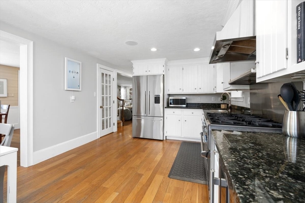 38 Smith Road Hingham, MA 02043 - Photo 10 of 42 a kitchen with stainless steel appliances granite countertop a refrigerator stove top oven and sink