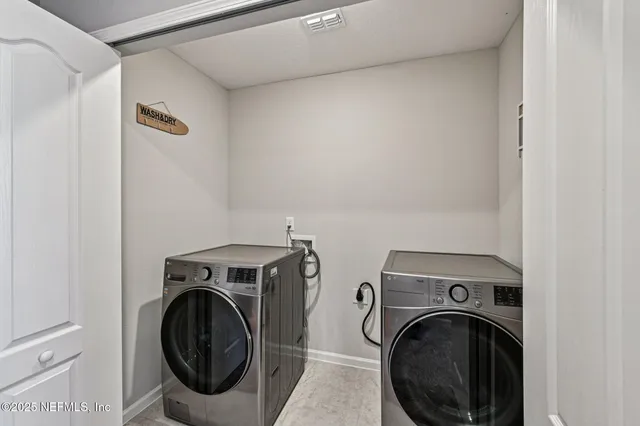 a utility room with dryer and washer
