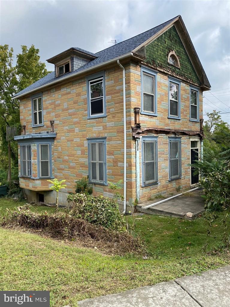 4616 Foote Street Northeast Washington, DC 20019 - Photo 1 of 25 a front view of a house with garden