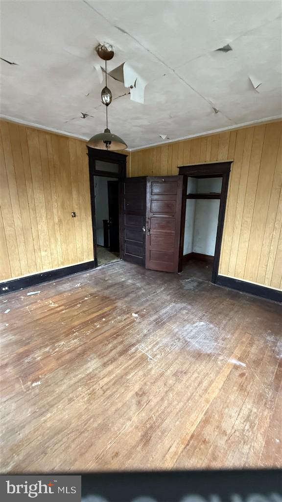 4616 Foote Street Northeast Washington, DC 20019 - Photo 21 of 25 a view of a livingroom with a fireplace a ceiling fan and wooden floor