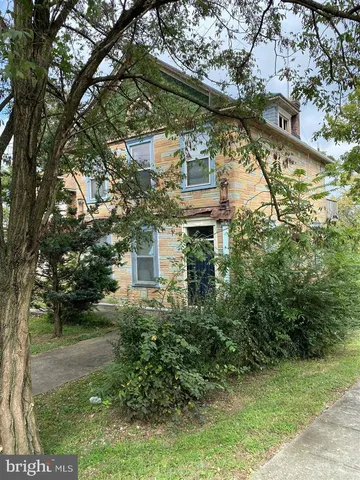 a aerial view of a house with a yard