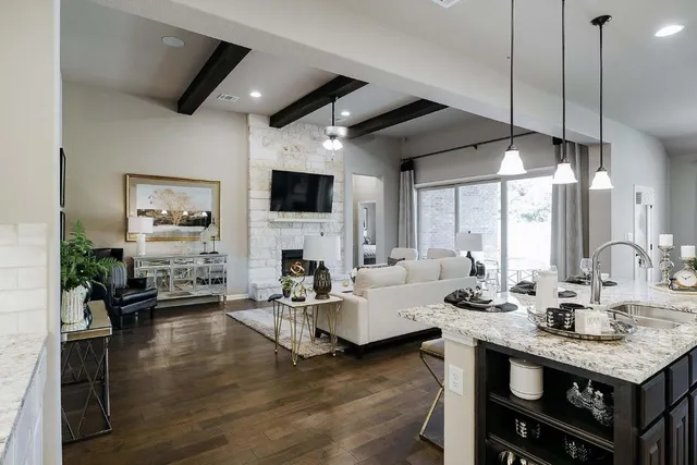 a living room with fireplace furniture and a flat screen tv