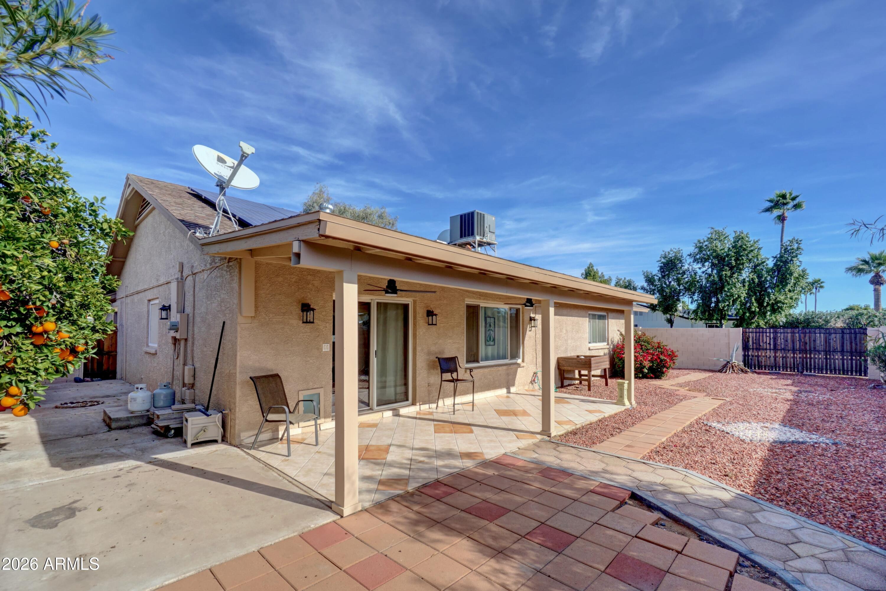 2749 East Sylvia Street Phoenix, AZ 85032 - Photo 38 of 44 a view of a house with a patio