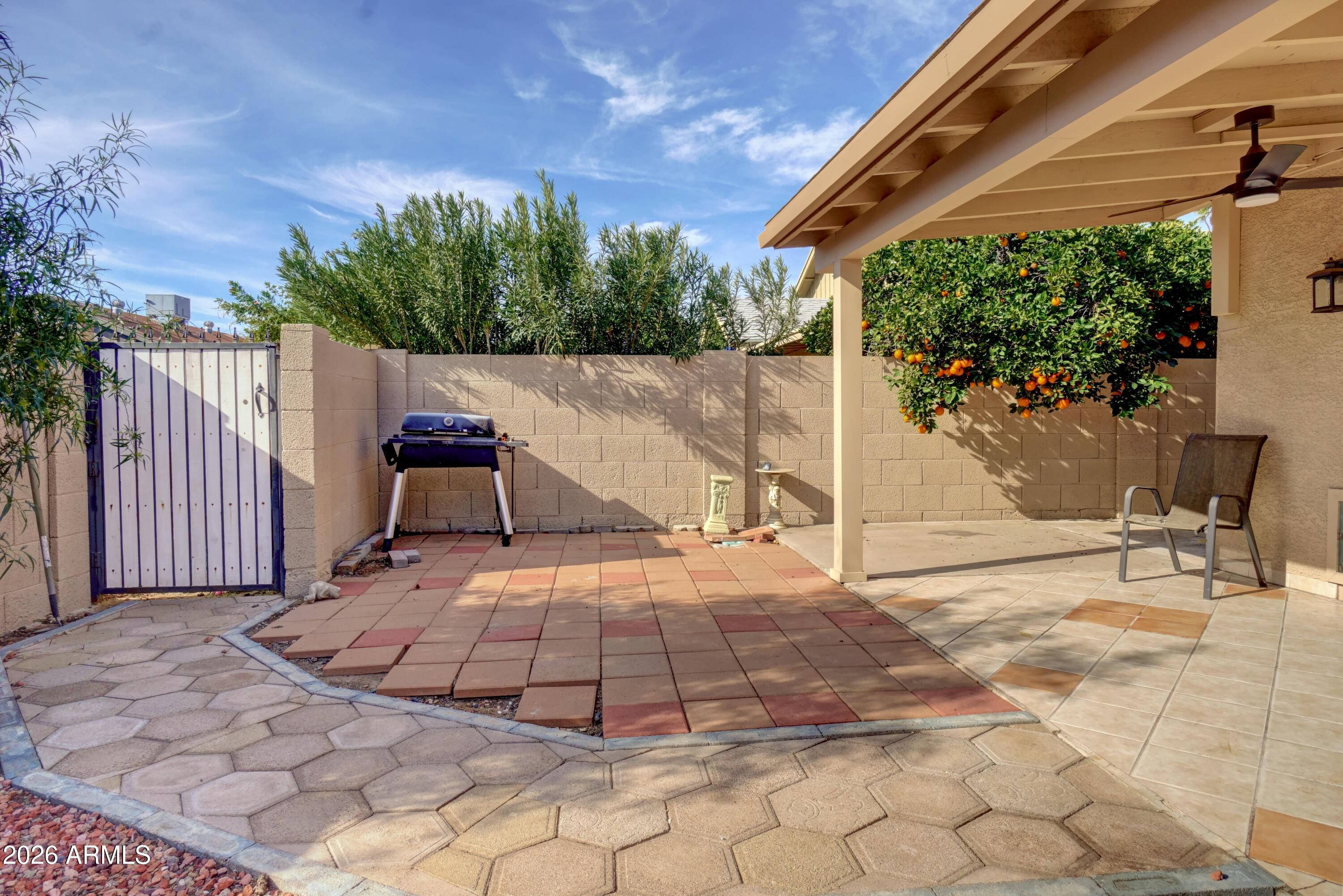 2749 East Sylvia Street Phoenix, AZ 85032 - Photo 40 of 44 a view of a chair and tables in the patio