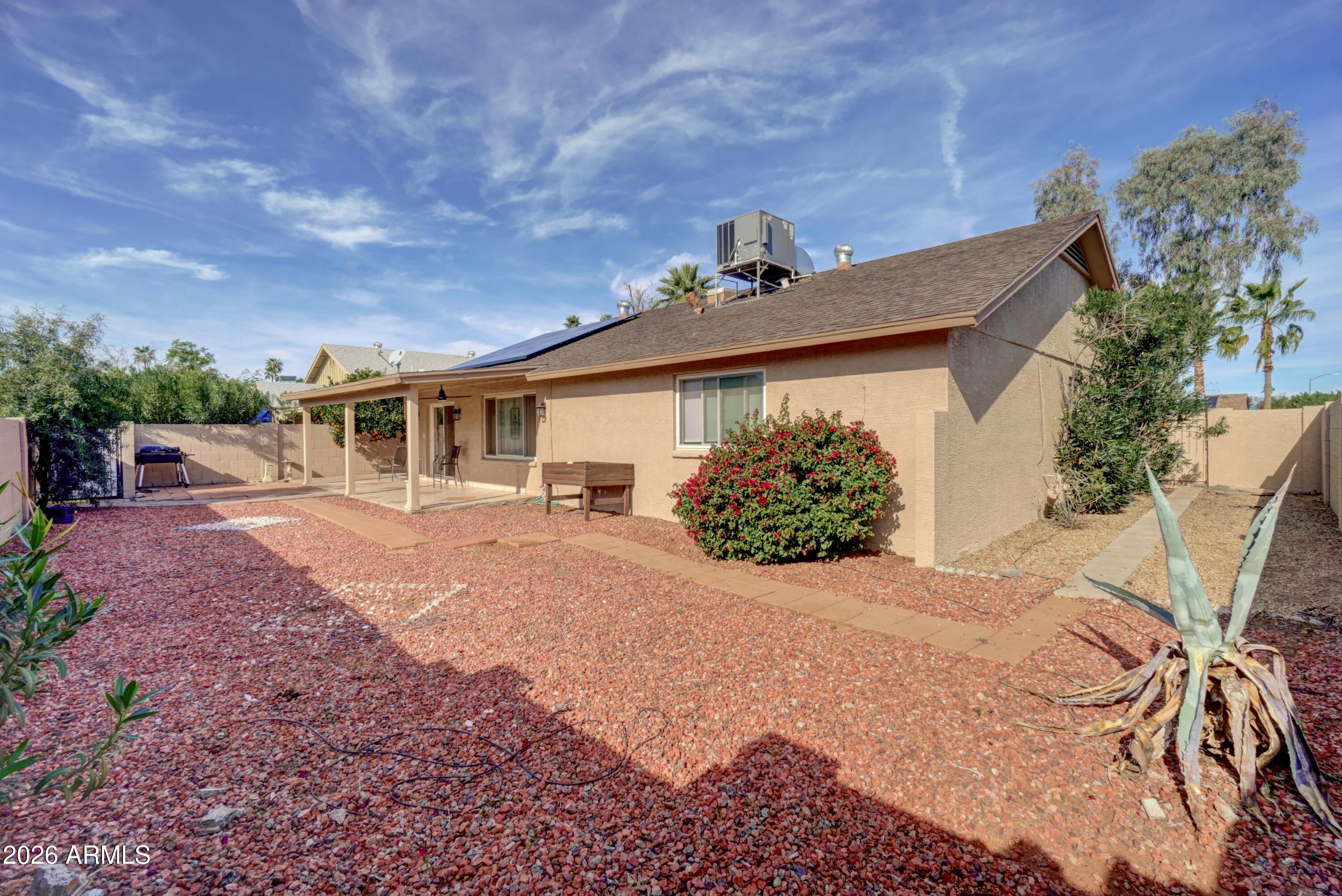 2749 East Sylvia Street Phoenix, AZ 85032 - Photo 41 of 44 a front view of a house with garden