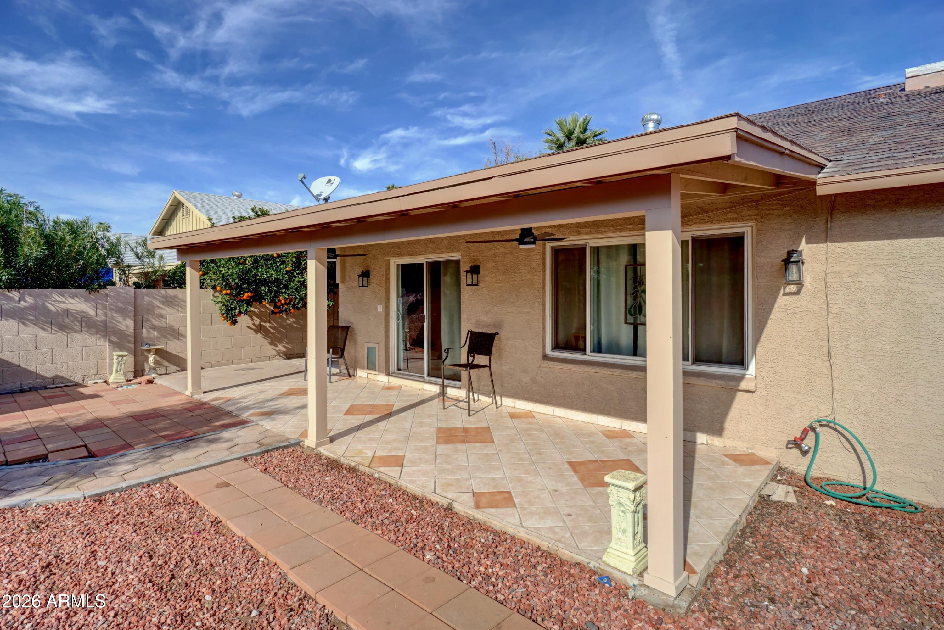 2749 East Sylvia Street Phoenix, AZ 85032 - Photo 44 of 44 a view of a house with backyard and porch