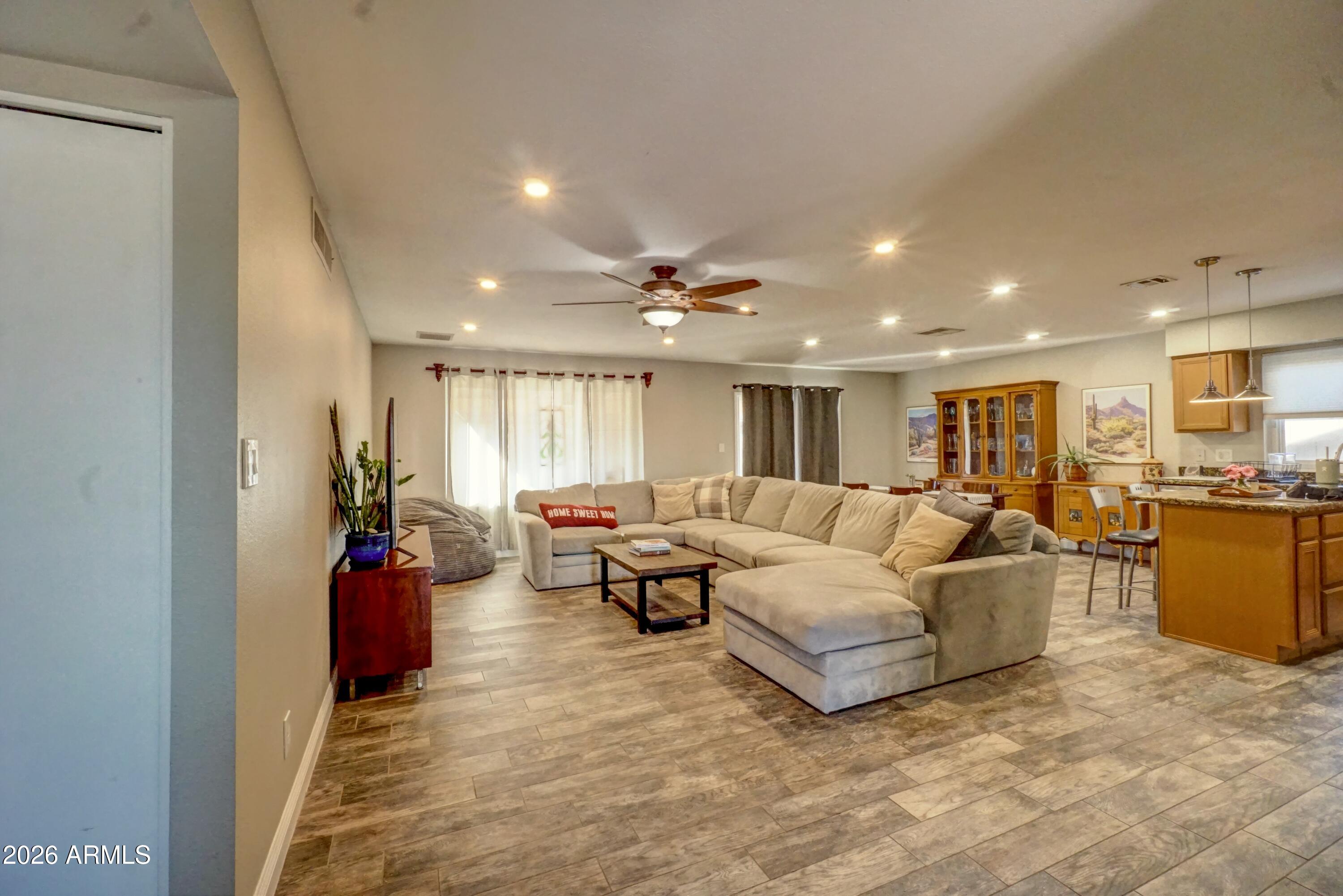 2749 East Sylvia Street Phoenix, AZ 85032 - Photo 6 of 44 a living room with furniture and a potted plant