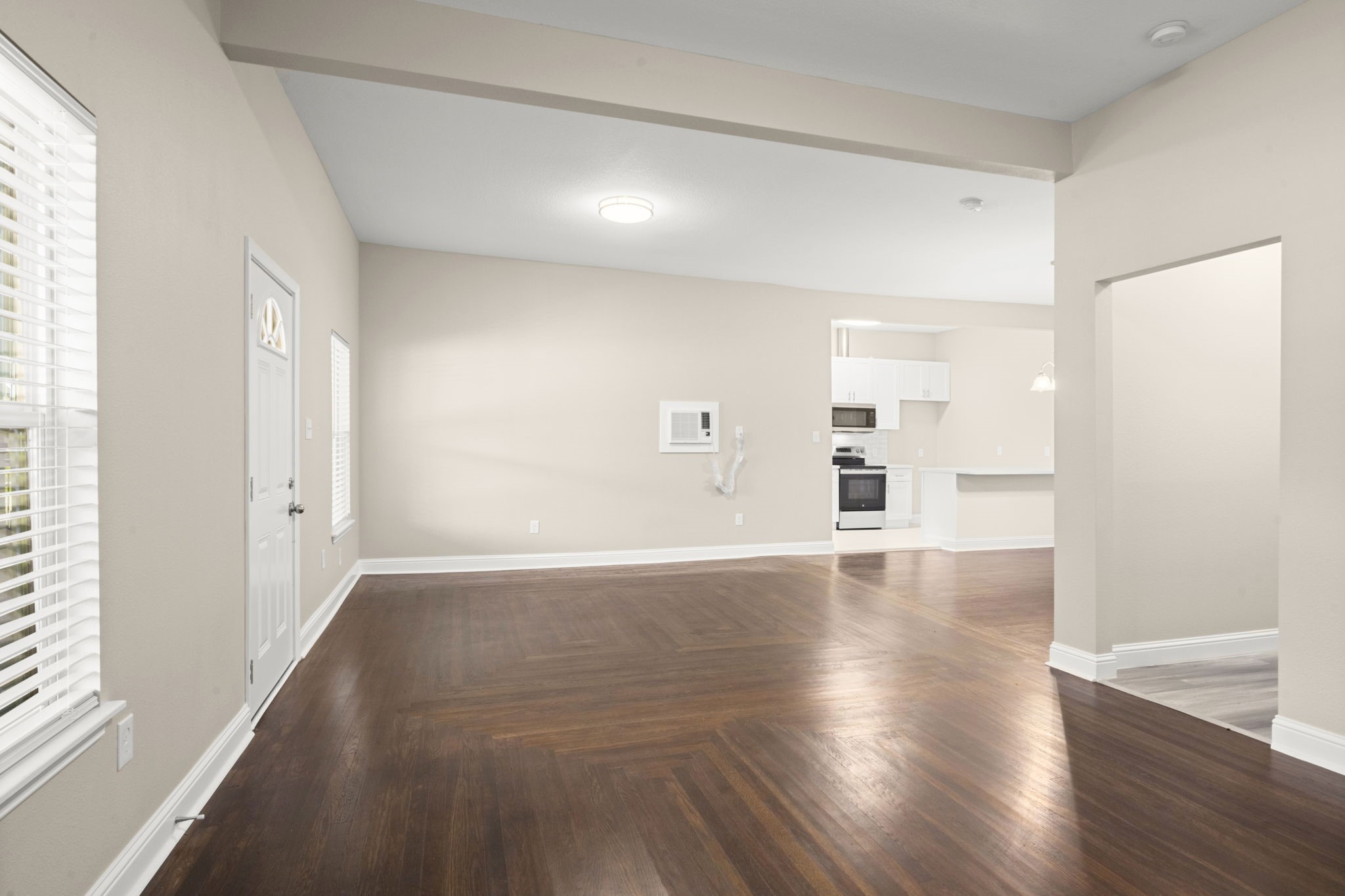 4902 McKinney Street Houston, TX 77023 - Photo 12 of 31 an empty room with wooden floor and windows
