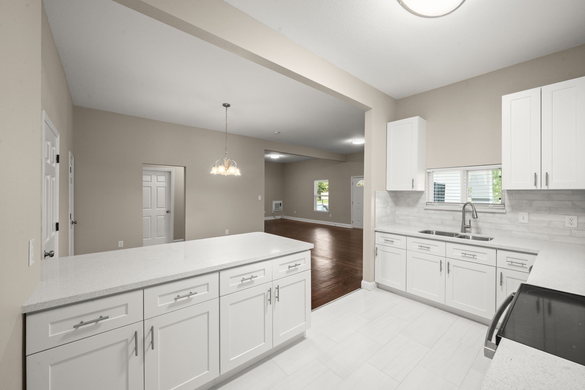 4902 McKinney Street Houston, TX 77023 - Photo 19 of 31 a spacious bathroom with a granite countertop sink mirror and cabinets