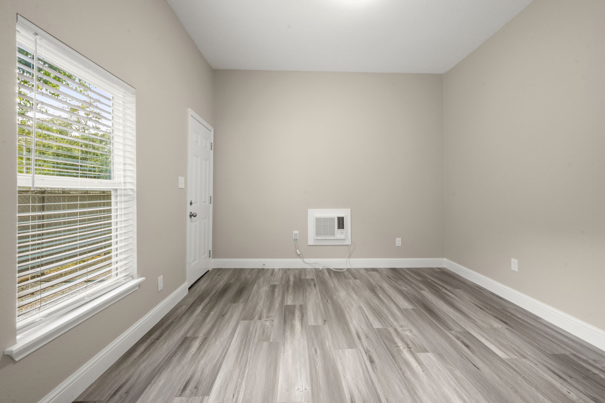 4902 McKinney Street Houston, TX 77023 - Photo 21 of 31 a view of a room with wooden floor and a window