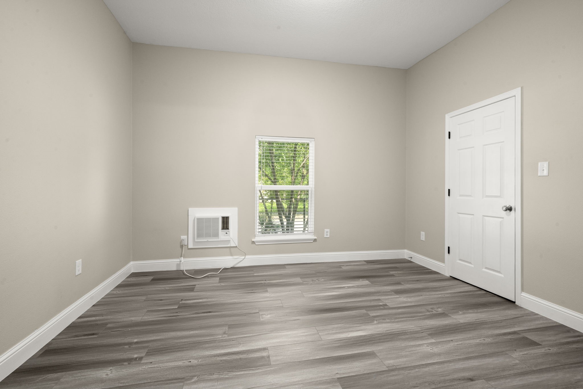 4902 McKinney Street Houston, TX 77023 - Photo 22 of 31 a view of an empty room with wooden floor and a window