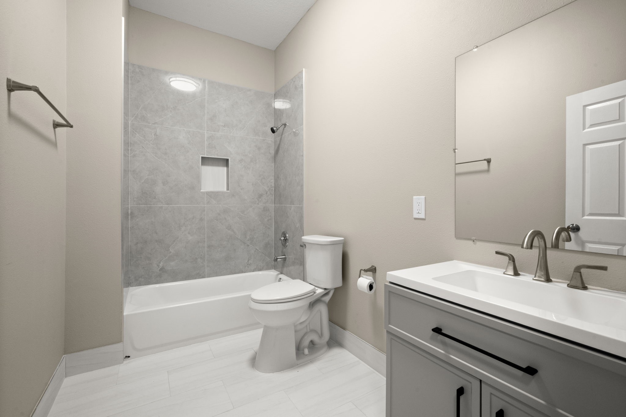 4902 McKinney Street Houston, TX 77023 - Photo 23 of 31 a bathroom with a sink a toilet and shower