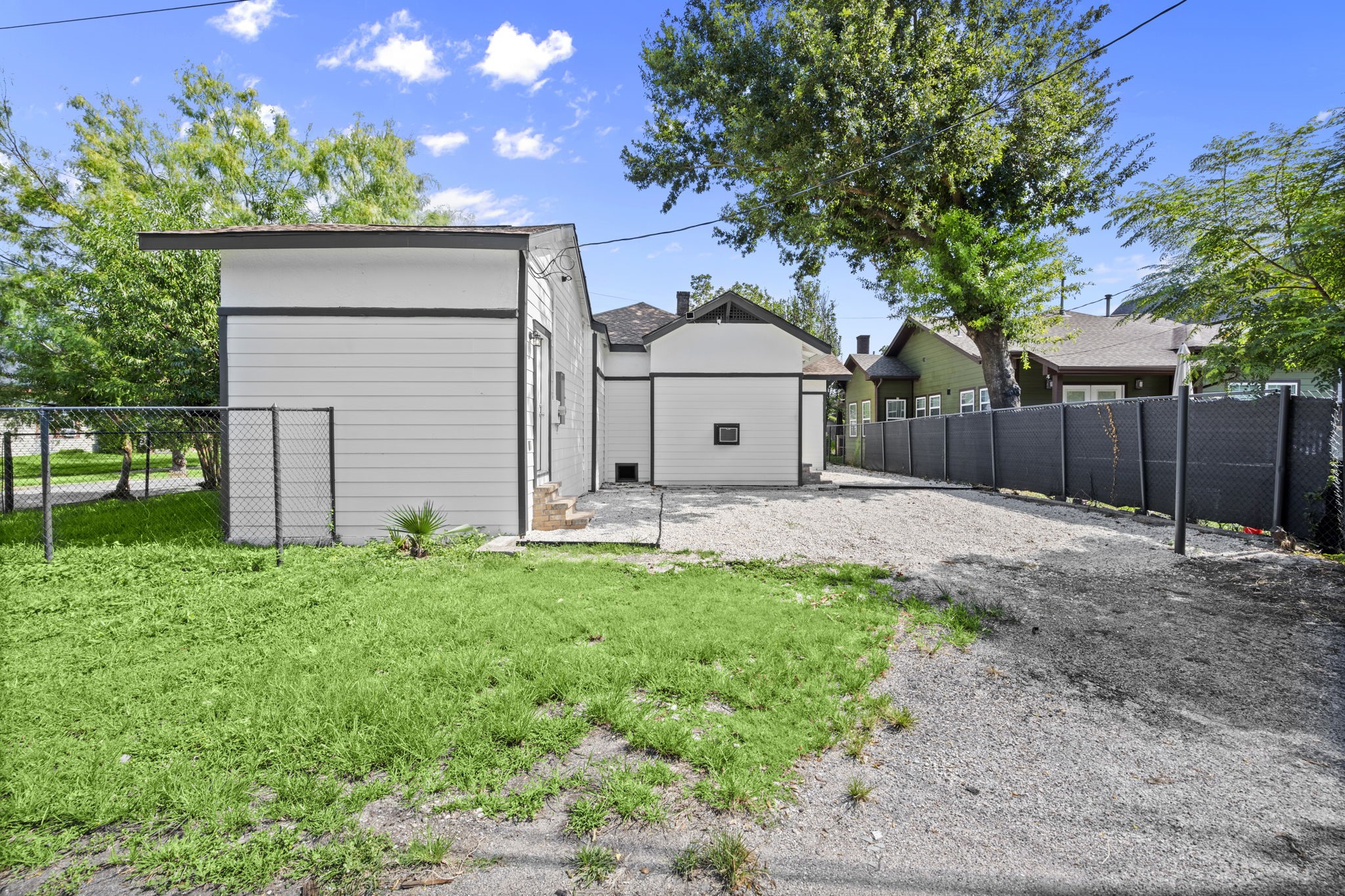 4902 McKinney Street Houston, TX 77023 - Photo 30 of 31 a front view of a house with a yard and garage