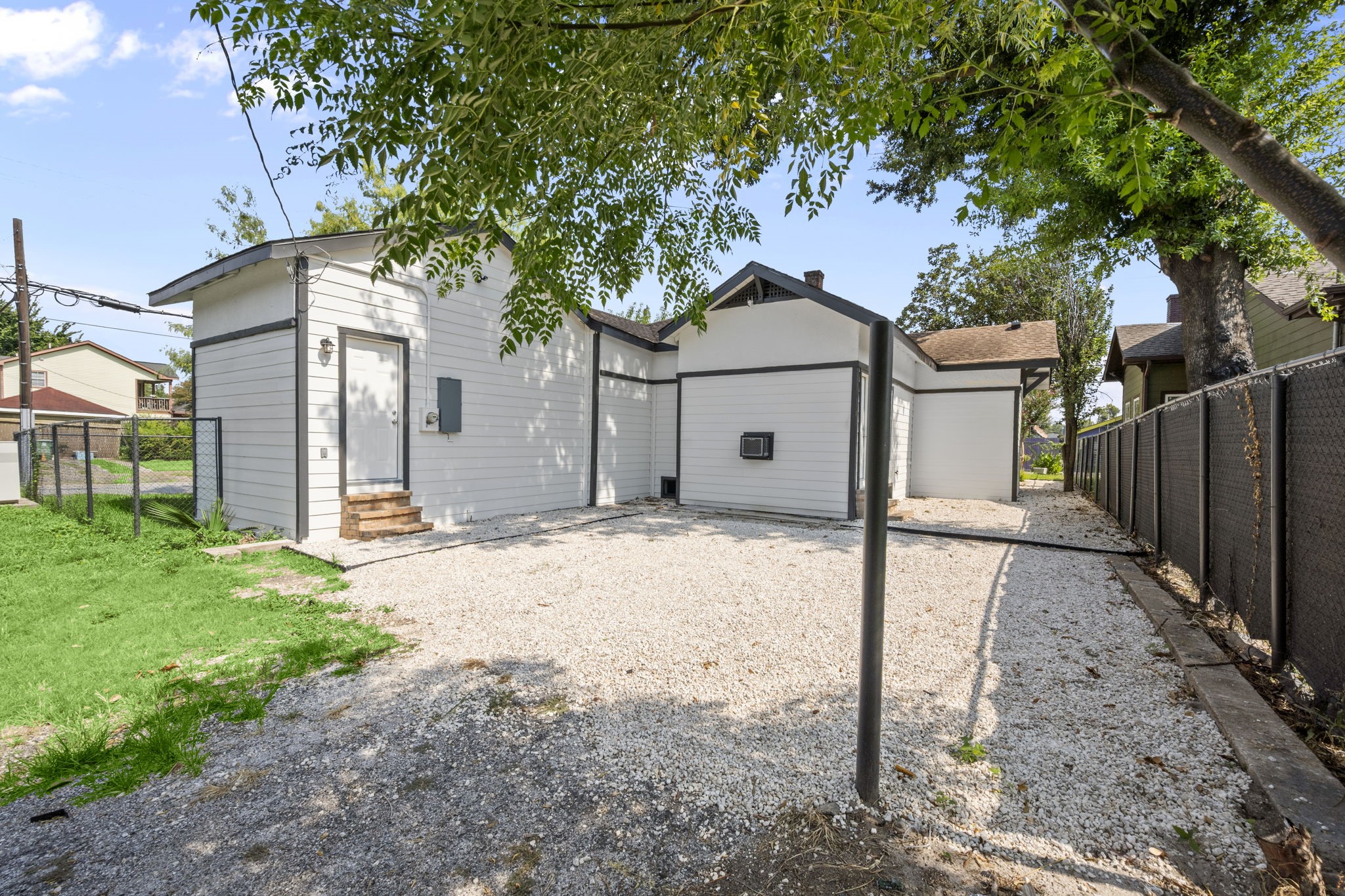 4902 McKinney Street Houston, TX 77023 - Photo 31 of 31 a front view of a house with a yard and garage