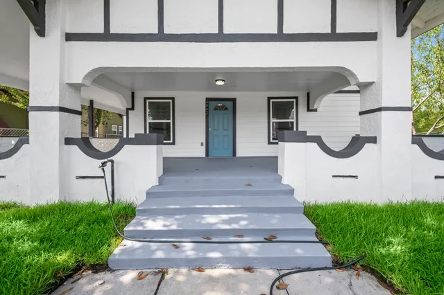 a front view of a house with garden