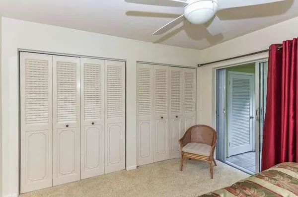 a view of a bedroom with closet area