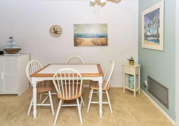 a view of a dining room with furniture