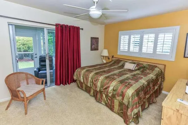 a bedroom with bed and window