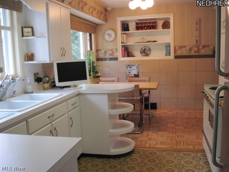 487 Sand Run Road Akron, OH 44313 - Photo 6 of 21 The kitchen has stainless steel appliances and a separate dinette area.