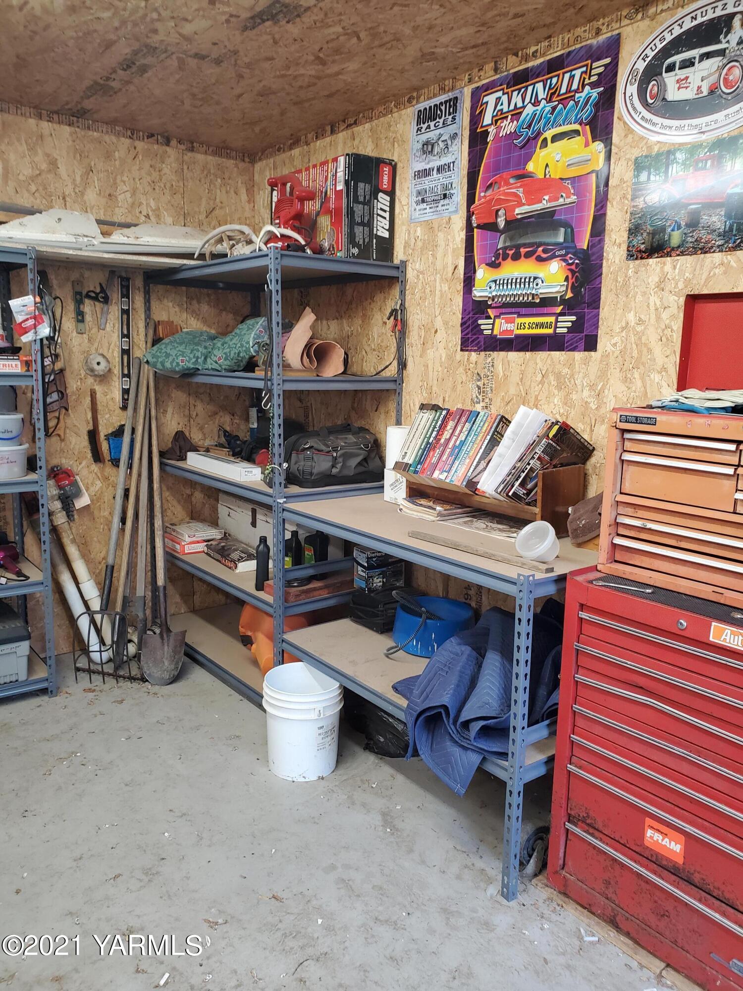 1090 Snipes Pump Road Sunnyside, WA 98944 - Photo 12 of 19 a room with storage and a white walls