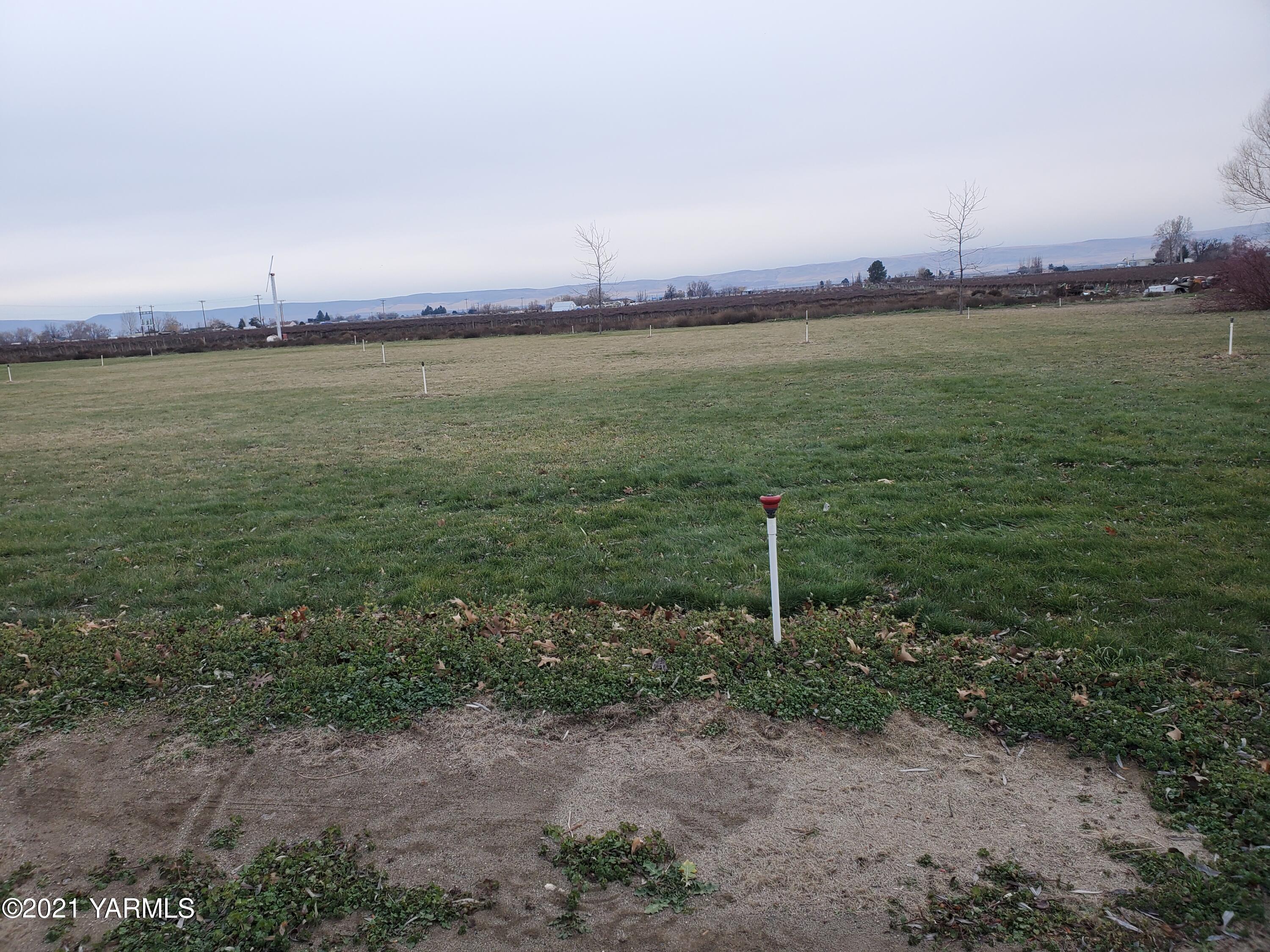 1090 Snipes Pump Road Sunnyside, WA 98944 - Photo 16 of 19 a view of a lake with a big yard