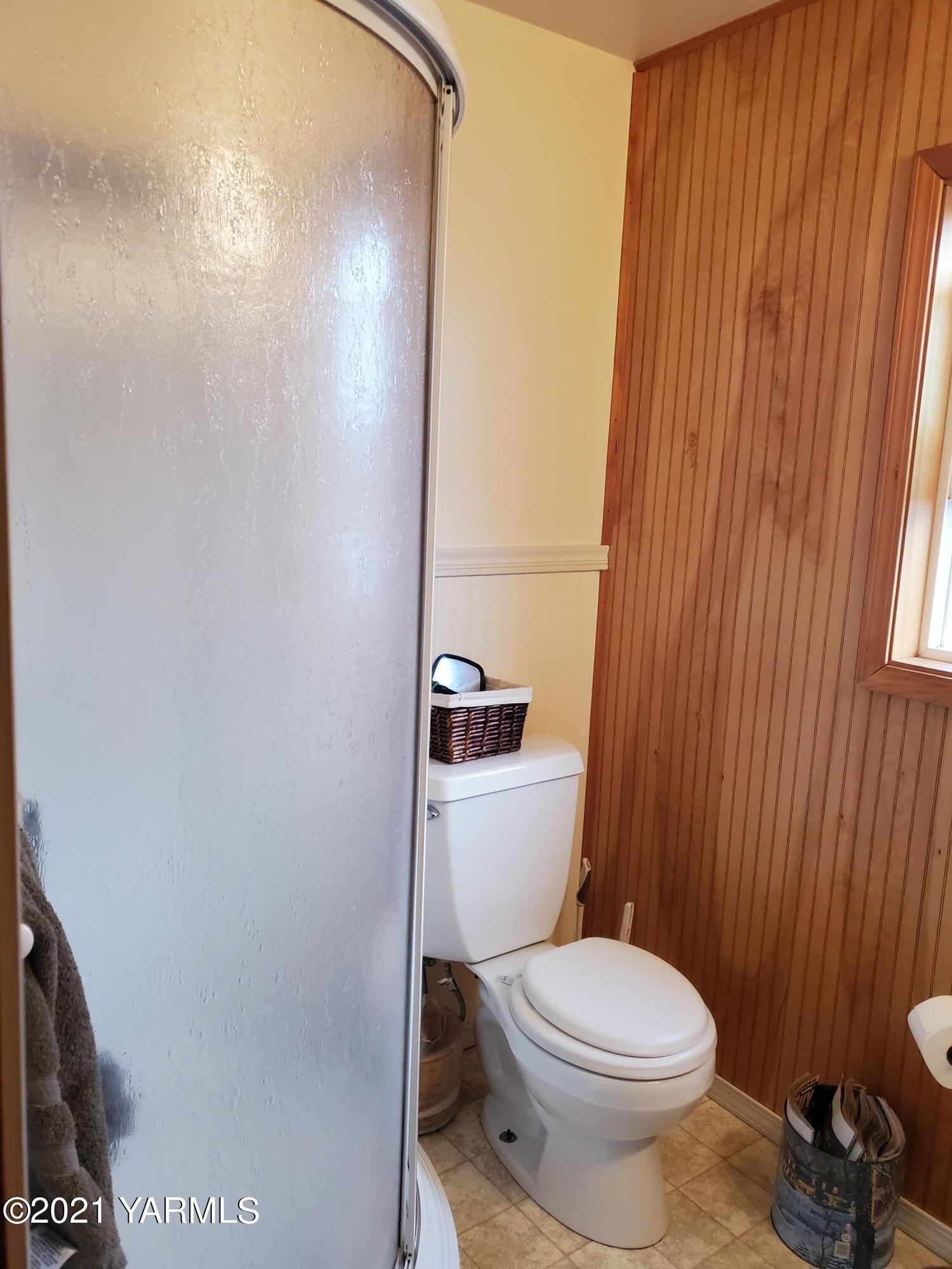 1090 Snipes Pump Road Sunnyside, WA 98944 - Photo 6 of 19 a white toilet sitting next to a small sink