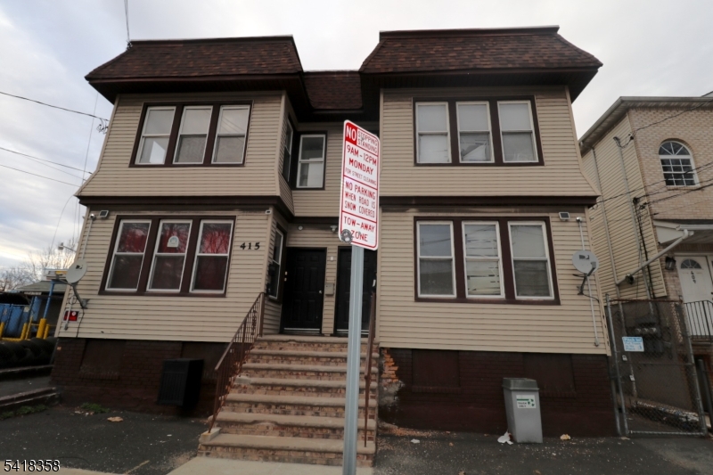 413 Lyons Avenue, Unit 2L Newark, NJ 07112 - Photo 15 of 15 a front view of a house with a window