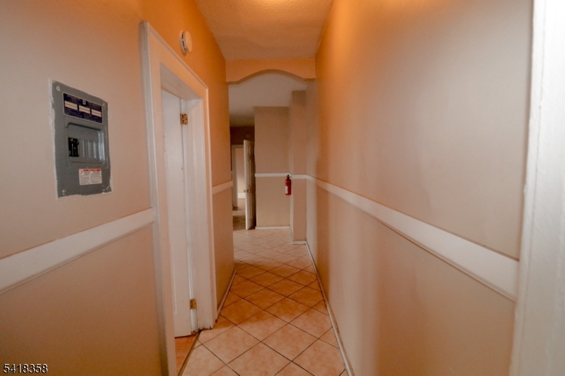413 Lyons Avenue, Unit 2L Newark, NJ 07112 - Photo 5 of 15 a view of a hallway