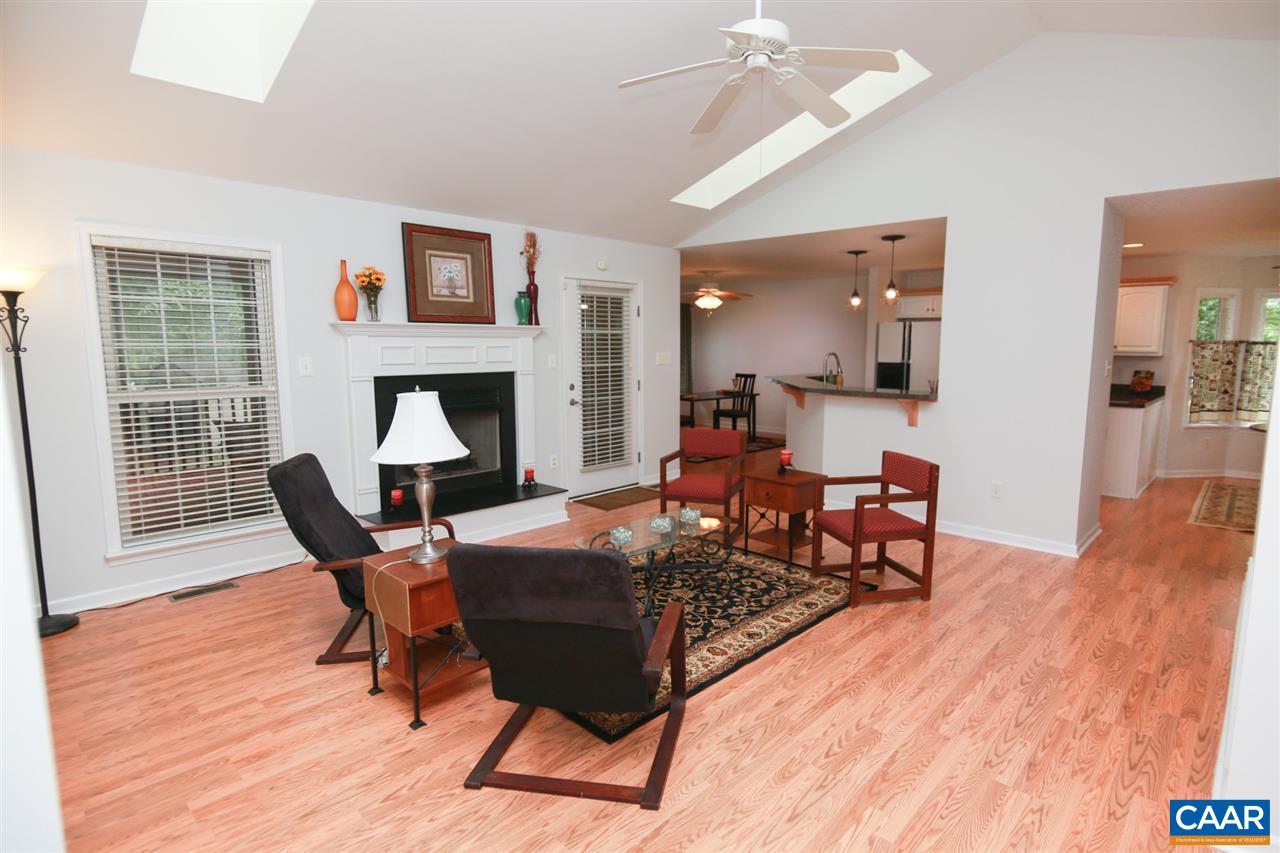 21 Xebec Road Palmyra, VA 22963 - Photo 10 of 41 a living room with furniture a fireplace and wooden floor