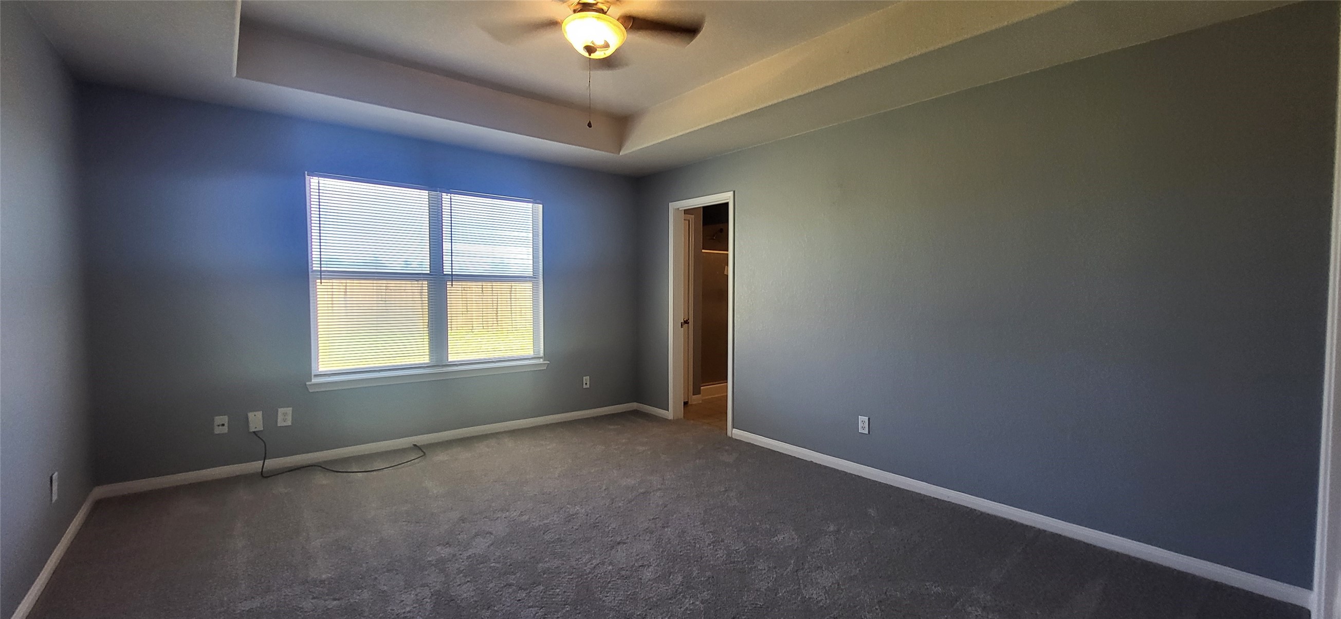 24022 Rockygate Drive Spring, TX 77373 - Photo 6 of 12 an empty room with a empty space and windows