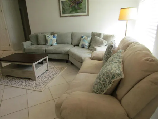 a living room with furniture and a couch
