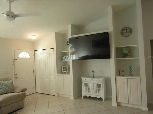 a living room with a couch and a flat screen tv