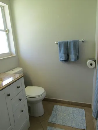 a bathroom with a toilet and a sink