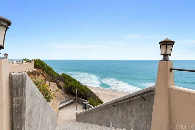 a view of a balcony with an ocean view