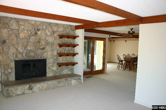 1535 Lillian Way Reno, NV 89509 - Photo 3 of 7 a view of a livingroom with a fireplace and a couch