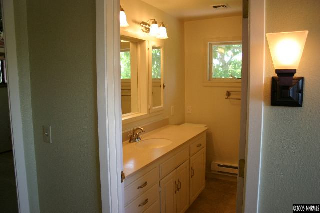 1535 Lillian Way Reno, NV 89509 - Photo 5 of 7 a bathroom with a sink and a mirror