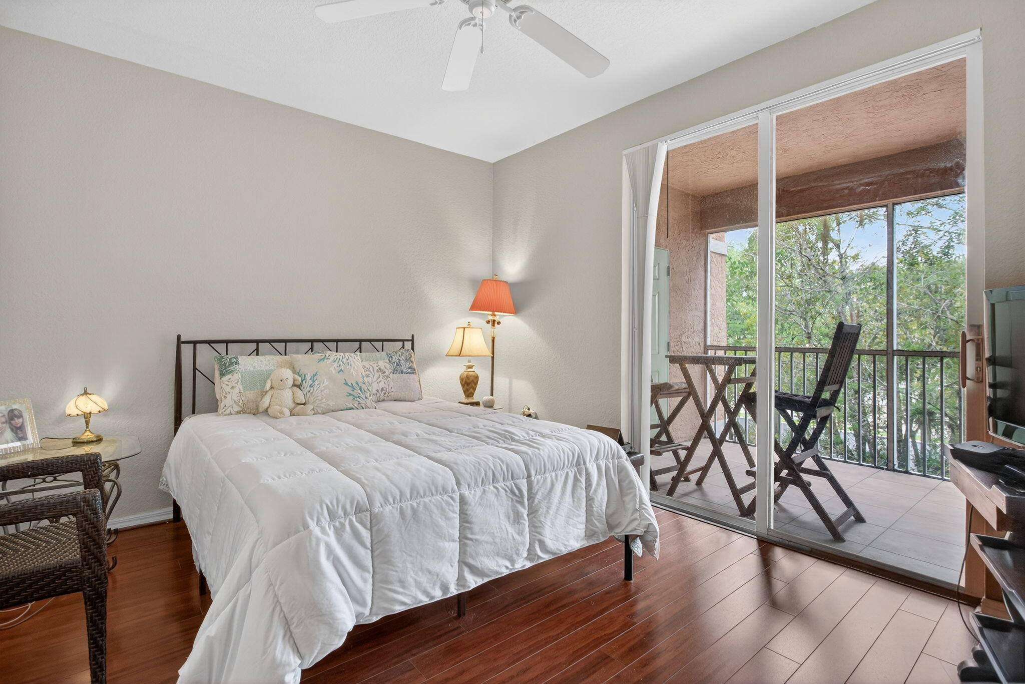 6890 West Sample Road, Unit 6890 Pompano Beach, FL 33063 - Photo 11 of 36 a bedroom with a bed and a large window