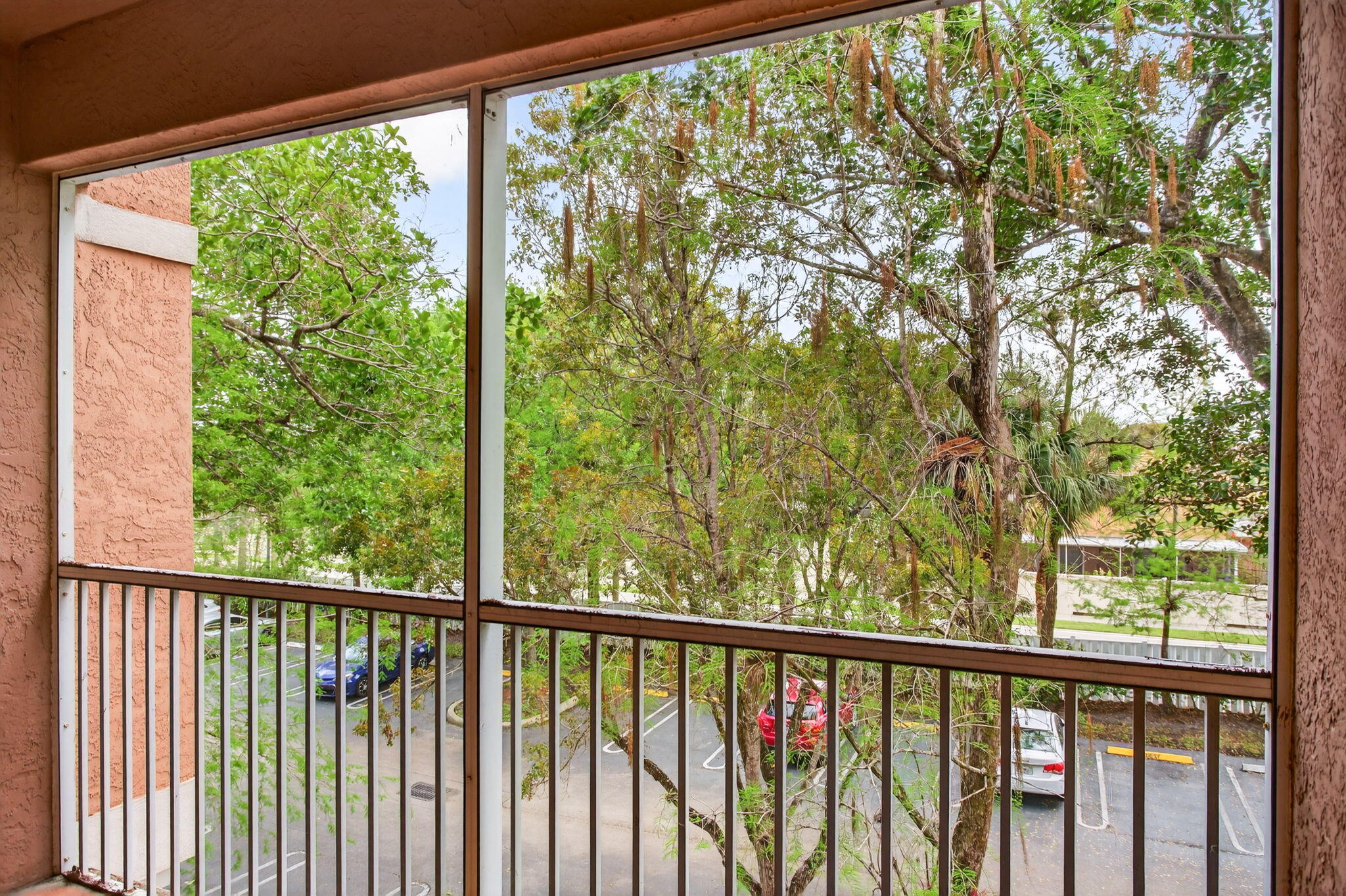 6890 West Sample Road, Unit 6890 Pompano Beach, FL 33063 - Photo 15 of 36 a view of a green space with a large tree