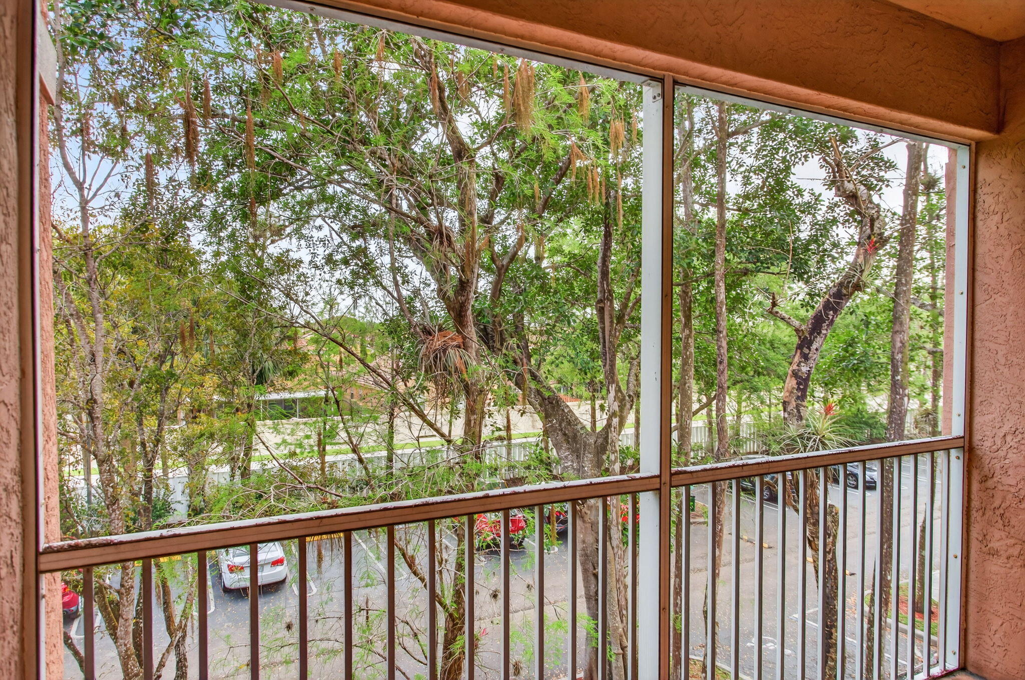 6890 West Sample Road, Unit 6890 Pompano Beach, FL 33063 - Photo 16 of 36 a view of balcony with yard